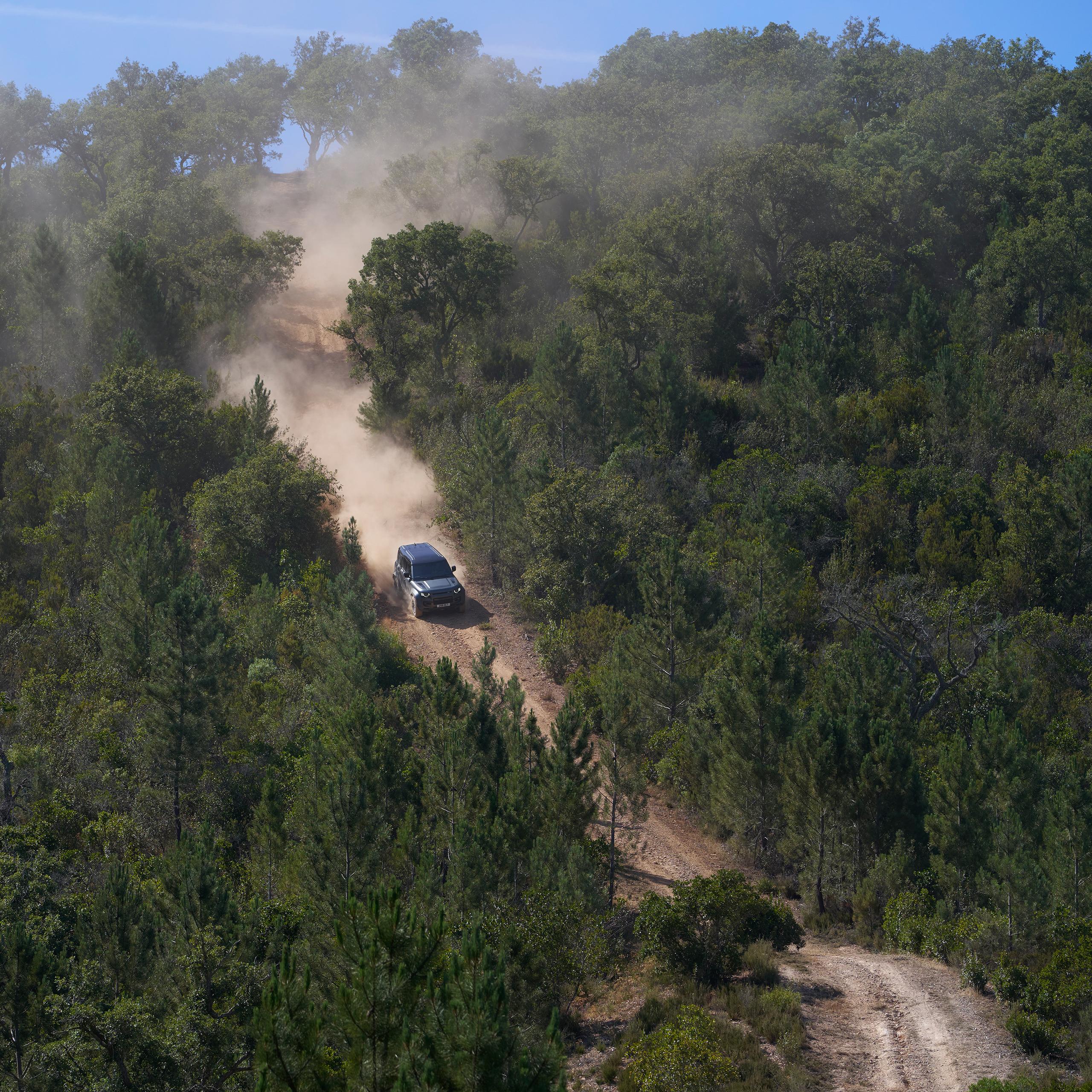 aerial shot of DEFENDER OCTA in a forest