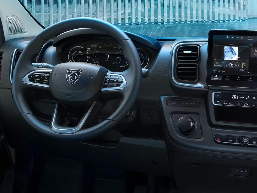 Modern Peugeot commercial vehicle dashboard featuring digital driver display and integrated touchscreen technology.