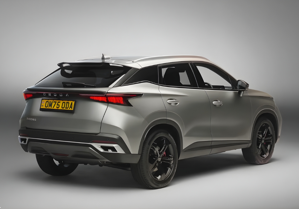 Rear three-quarter view of the OMODA 5 highlighting LED taillights, rear spoiler, and sculpted body lines.