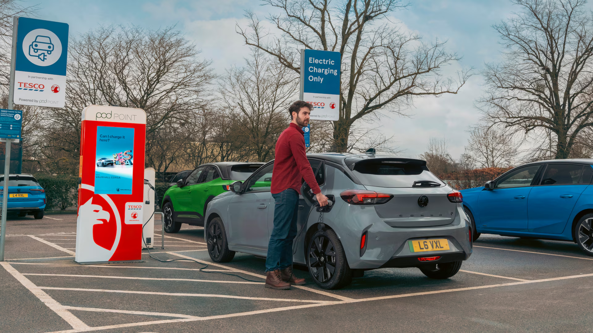 Person putting Vauxhall vehicle on charge