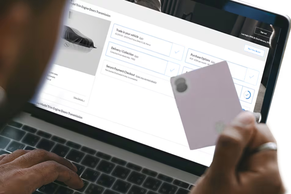 Person viewing a car on a laptop