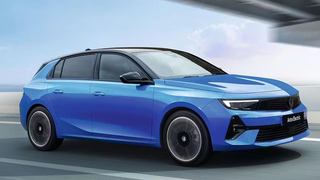 Blue Vauxhall Astra Electric driving on the road, showcasing its sleek design and aerodynamic styling.