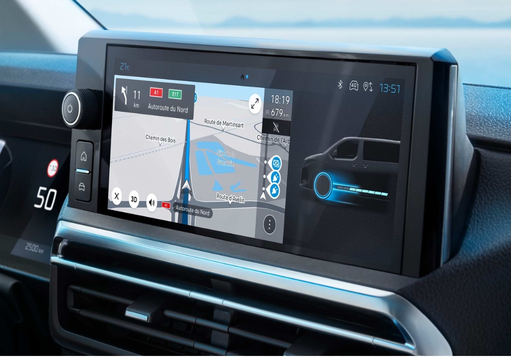 Peugeot e-Expert touchscreen displaying navigation map and battery energy flow information.