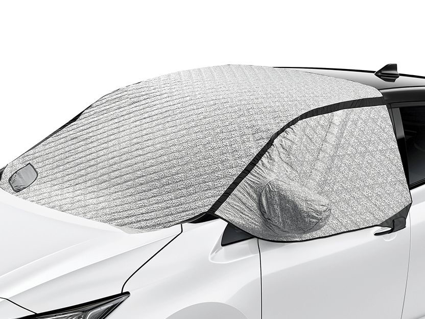 Front windshield sunshade installed on a Nissan vehicle, covering the glass and side mirrors for protection from sunlight.