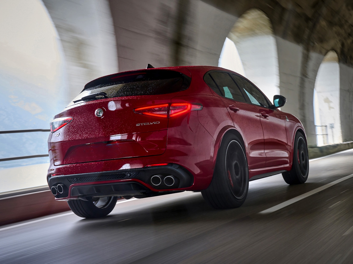 Stelvio Quadrifoglio driving shot rear view