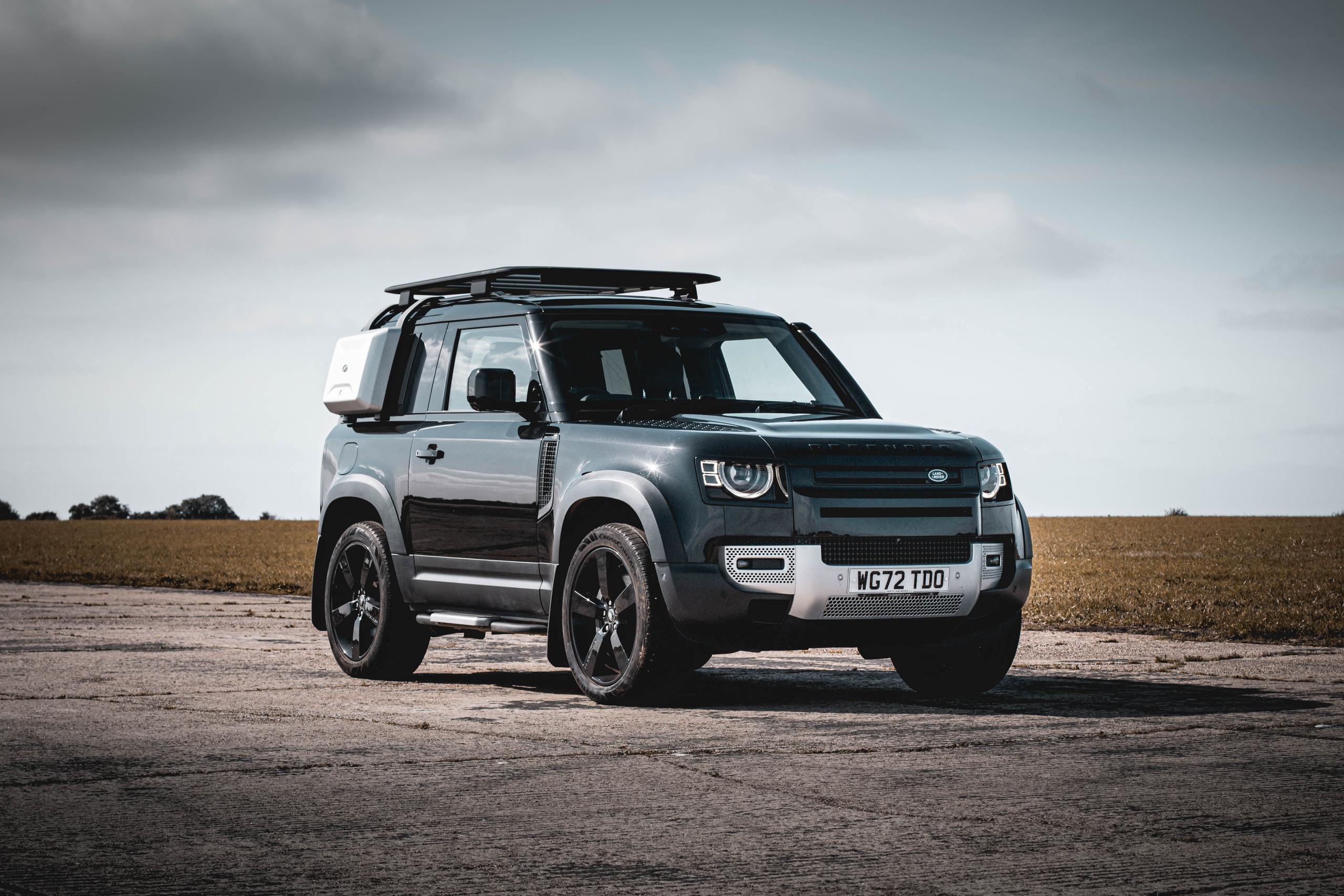 black land rover defender