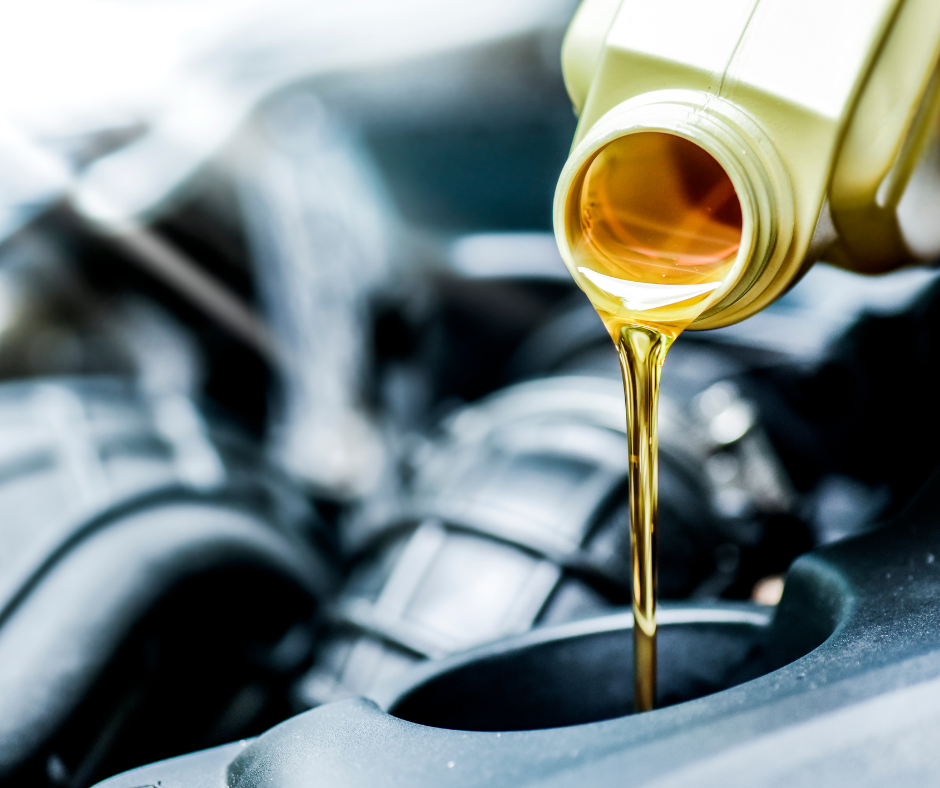 putting oil in car