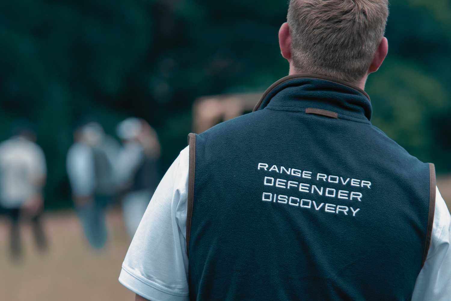 Man wearing Range Rover Defender Discovery branded gilet.