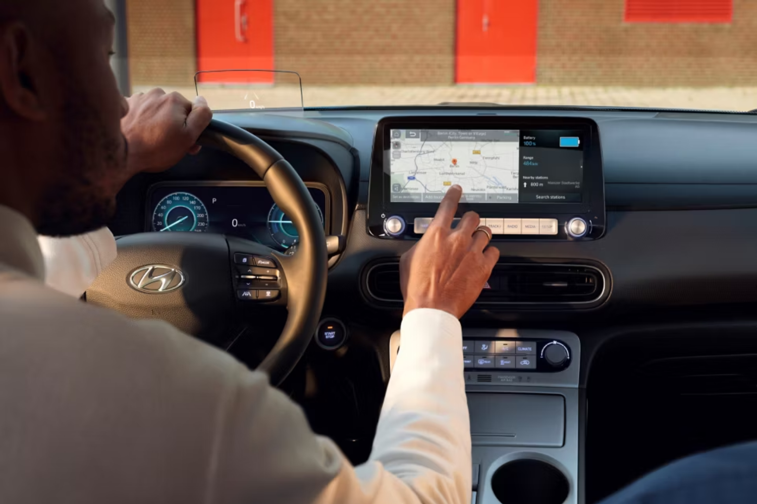 someone tapping on their car media screen