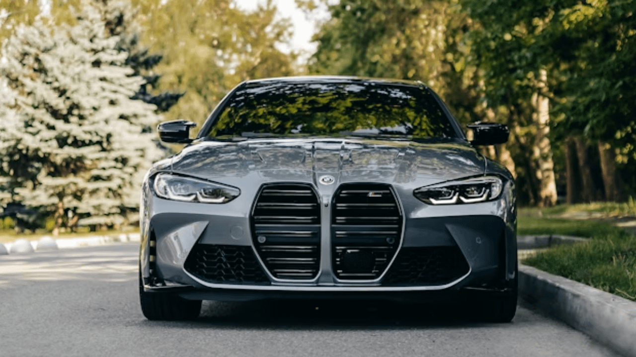 Front view of grey BMW with large kidney grille.