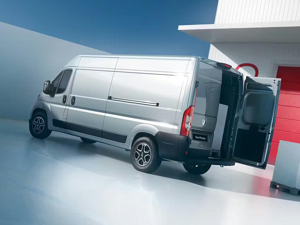 Grey Vauxhall Movano van displayed in a bright studio with the rear doors open.