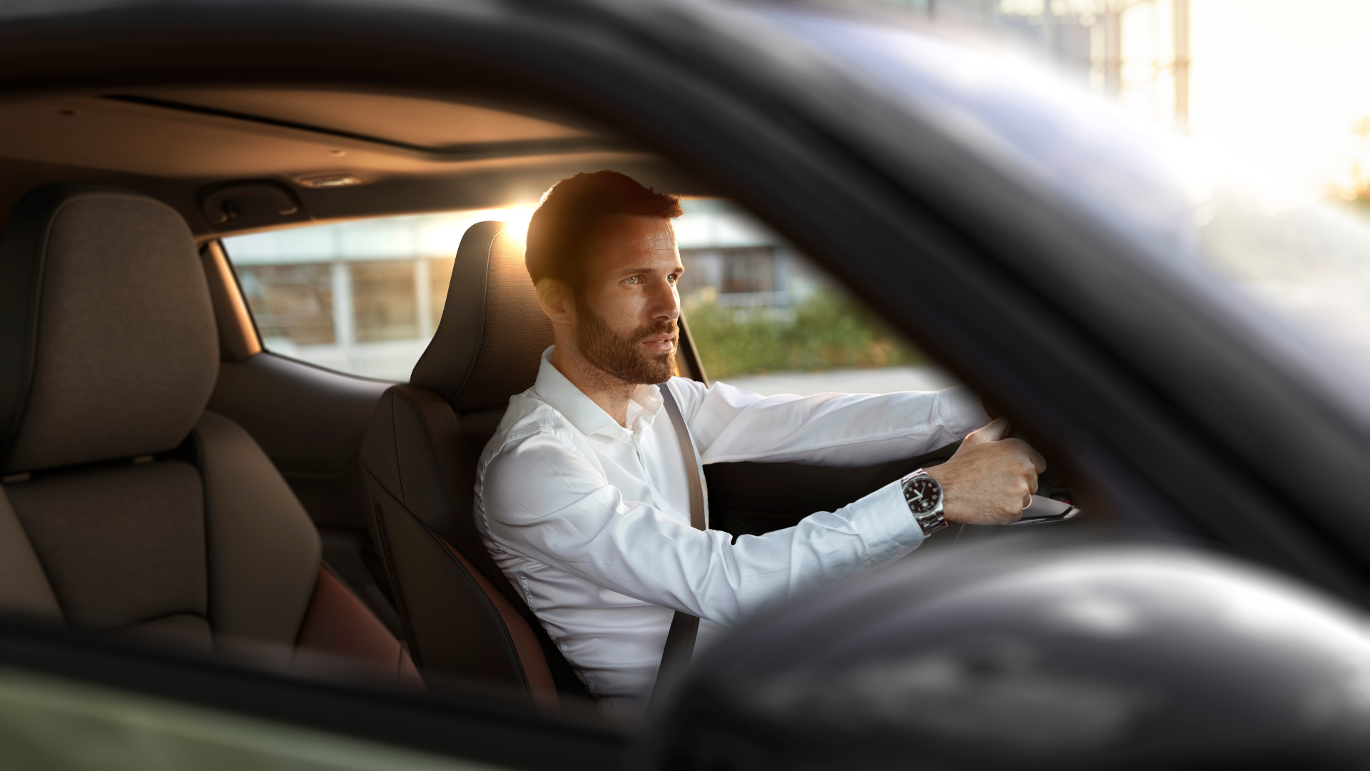 Man driving Suzuki E-Vitara
