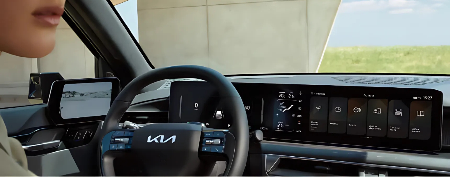 Kia EV9 Interior featuring the steering wheel and display screen.