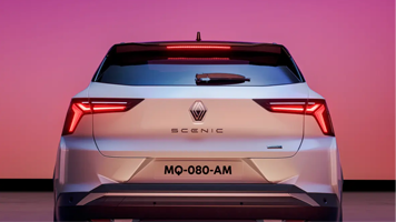 Rear view of silver Scenic with pink lighting
