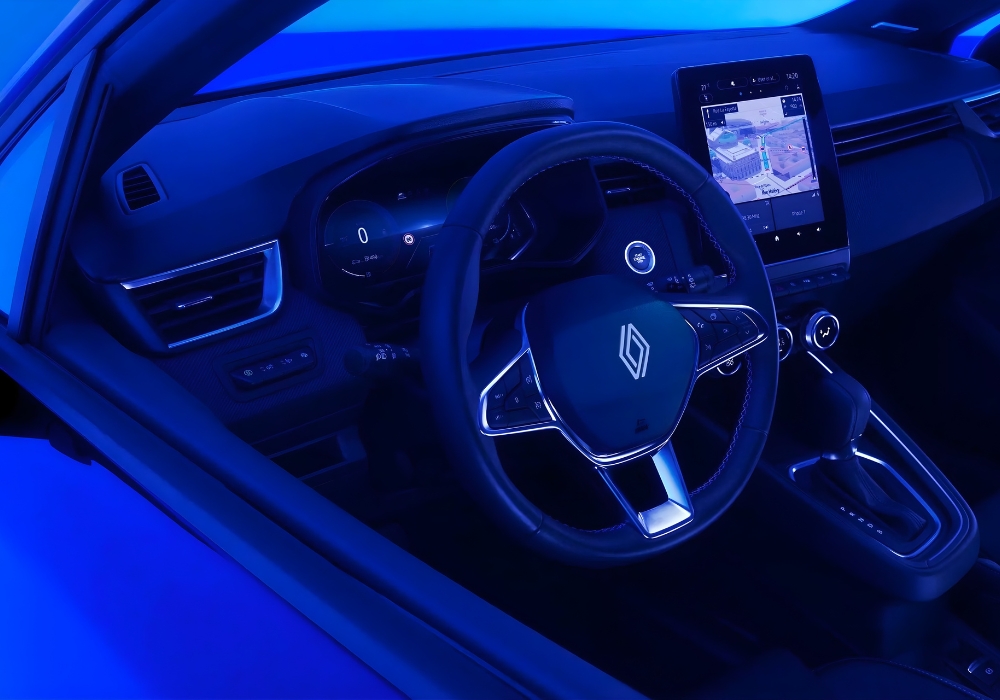Renault Clio interior with steering wheel, infotainment screen and centre console.