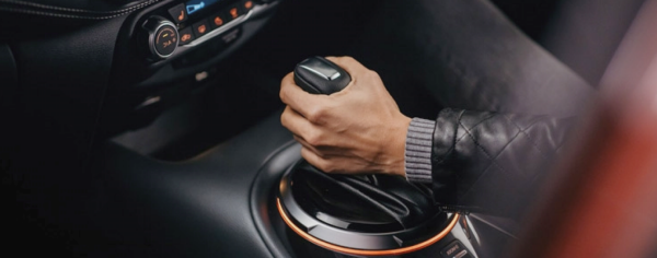 Close up of hand on gear stick