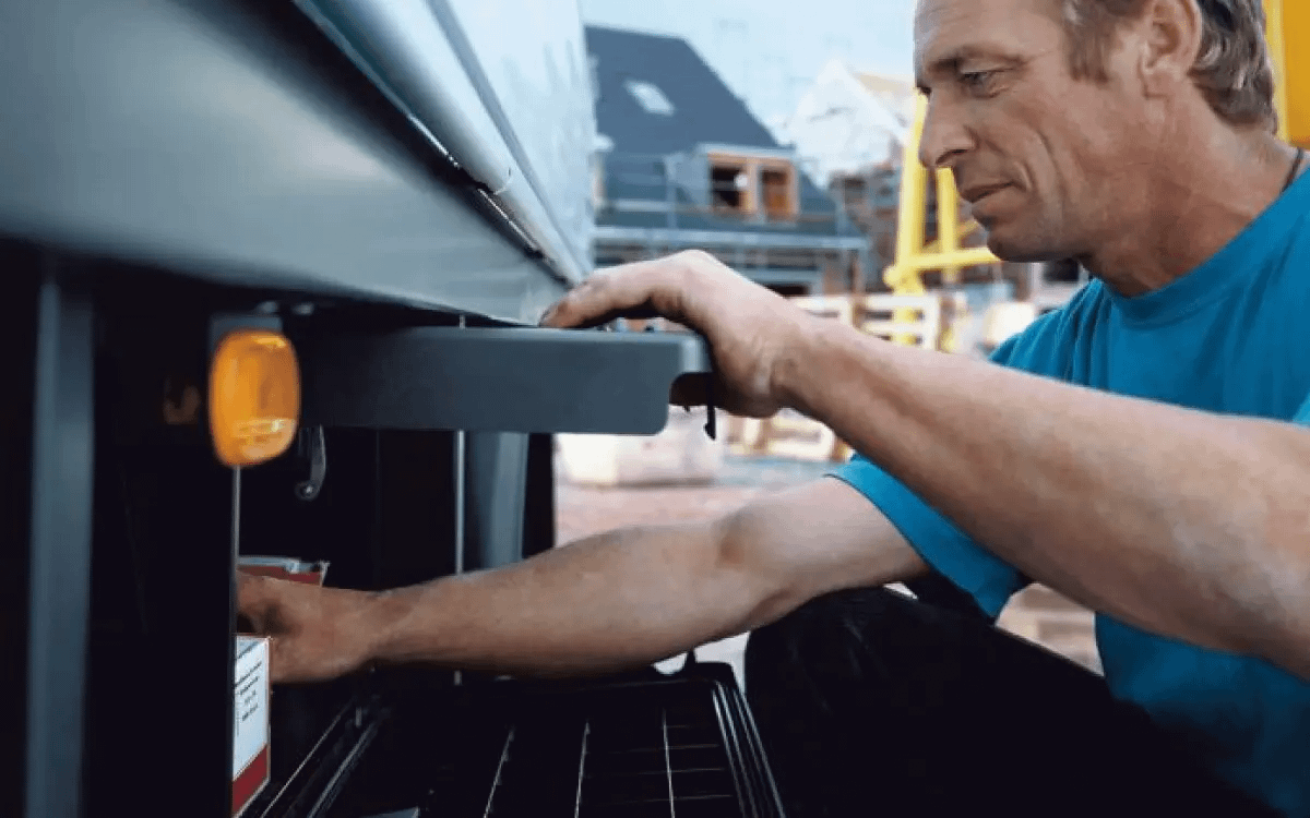 Mechanic Inspecting Vehicle