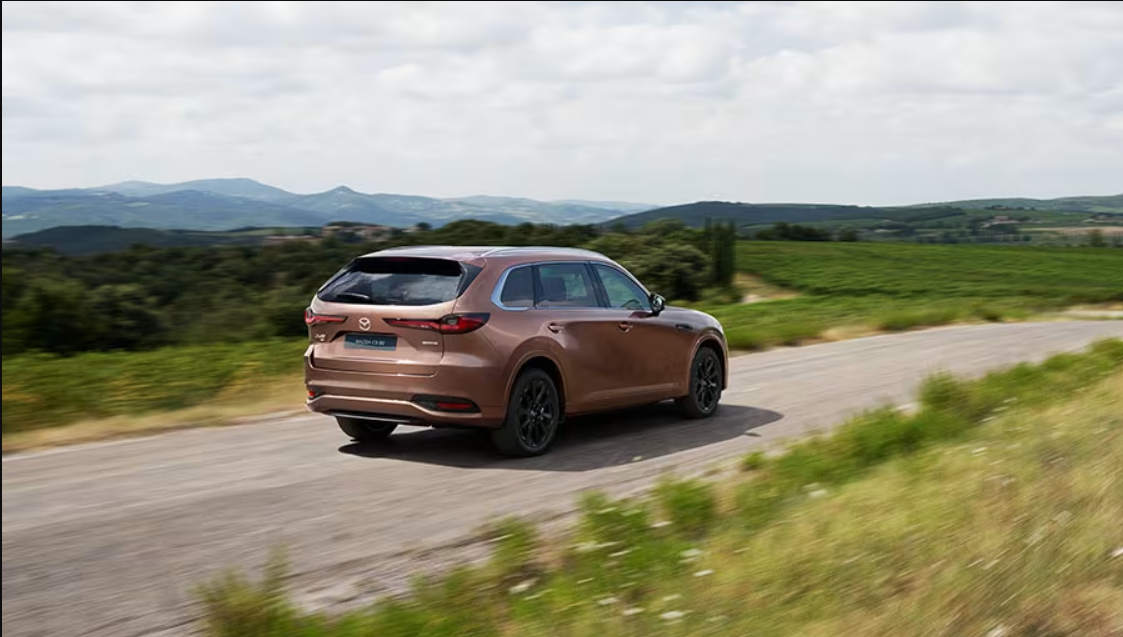 Gold CX-30 driving