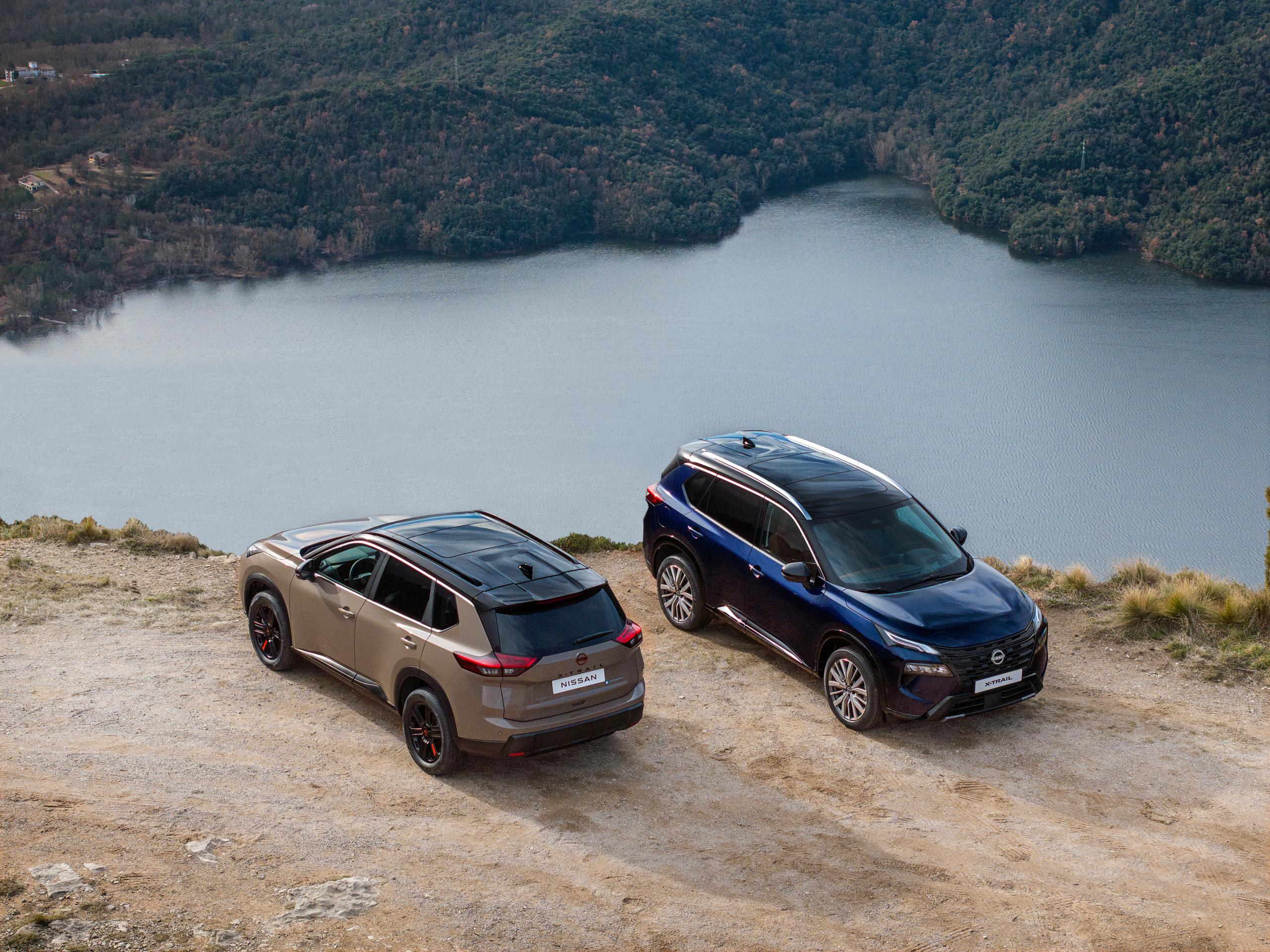 brown and blue SUV next to lake