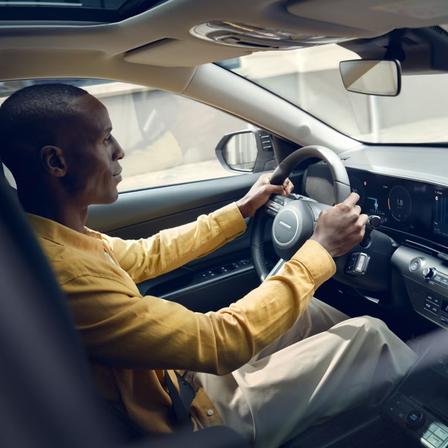 man driving Hyundai Kona