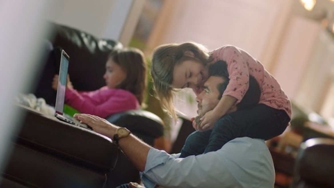 family browsing internet dad and daughter