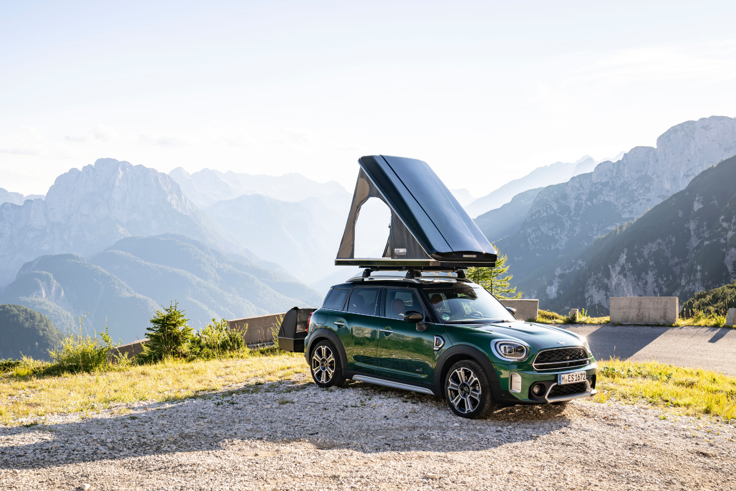 MINI Countryman with rooftop tent in mountain setting.