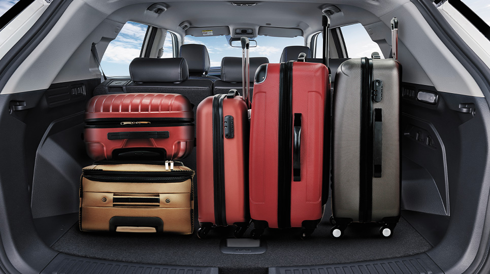 luggage neatly piled in the boot of a SsangYong vehicle