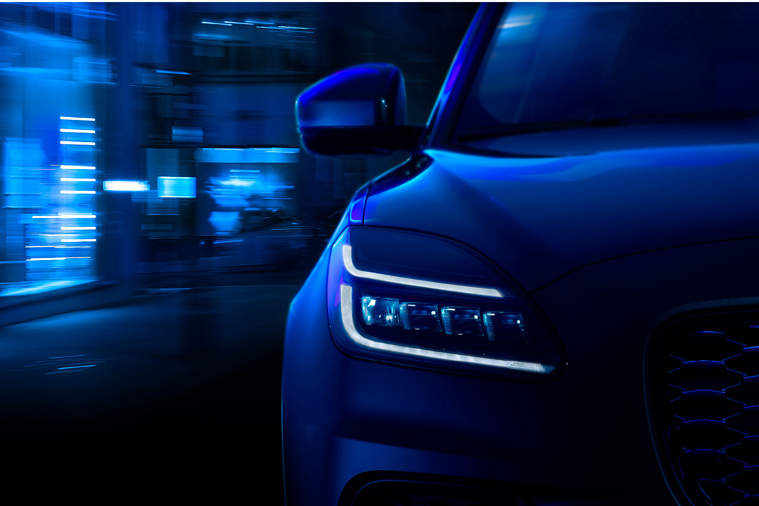 Blue Jaguar Front Headlights Close Up