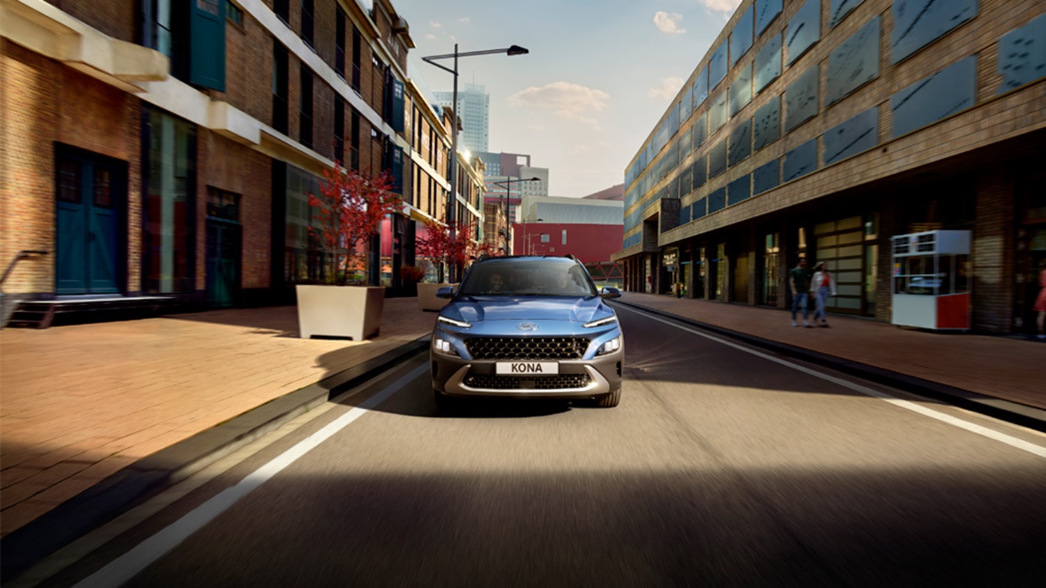 Blue Hyundai KONA Hybrid driving