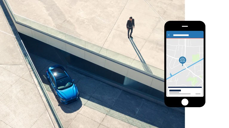 Ford car parked in a car park with a mobile app screenshot showing its location.