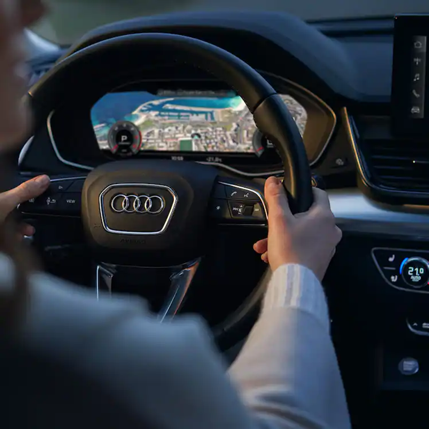 Man driving an Audi car