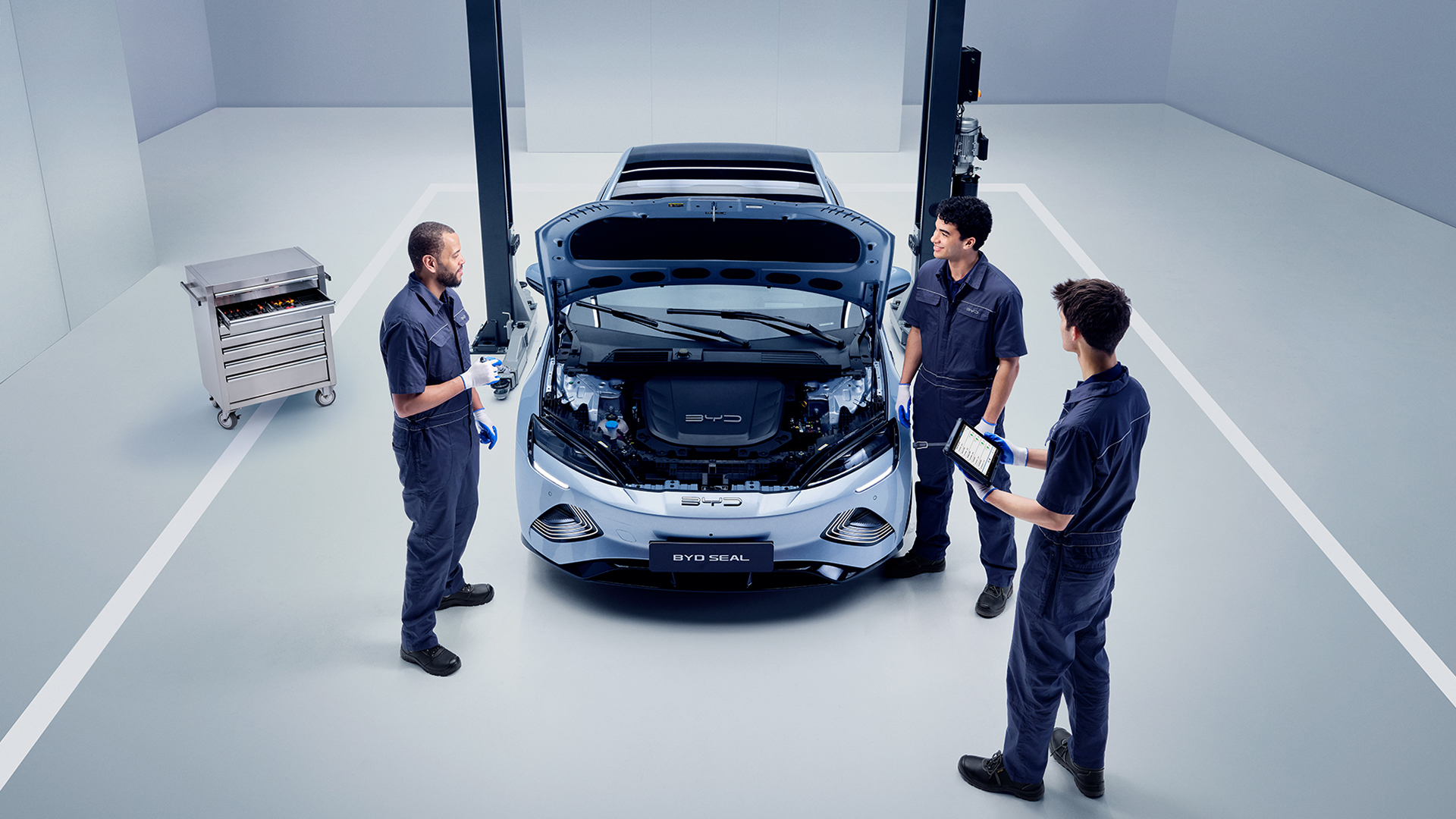 Mechanics Stood next to BYD Vehicle with hood up