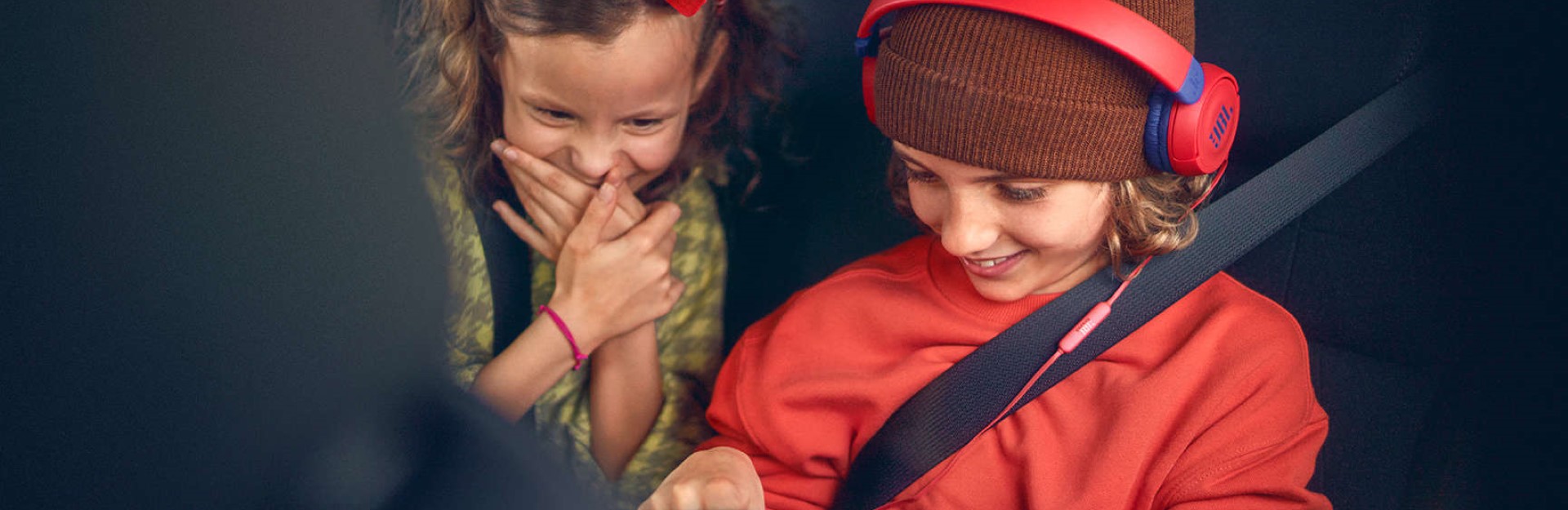 Children sat in backseat of car