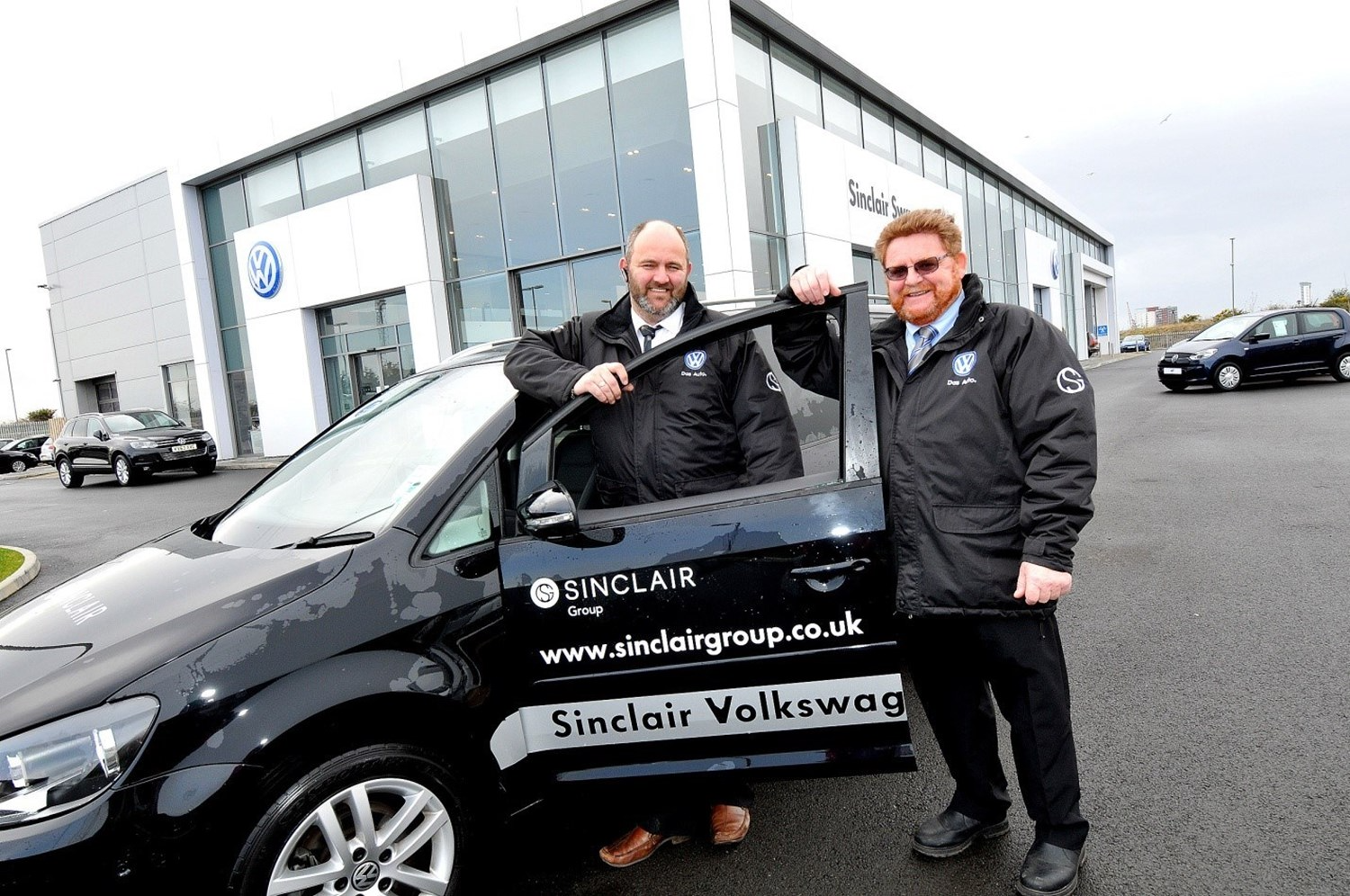 Sinclair Group advertised on Volkswagen vehicle