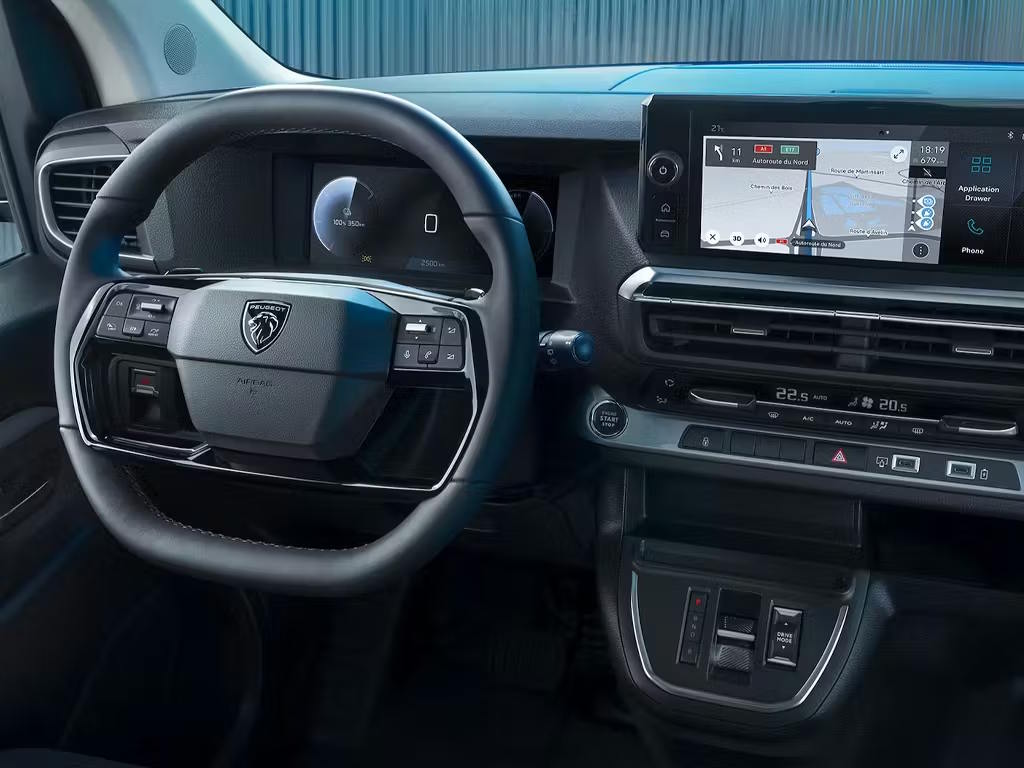Modern Peugeot commercial vehicle cockpit featuring digital driver display and touchscreen infotainment system.