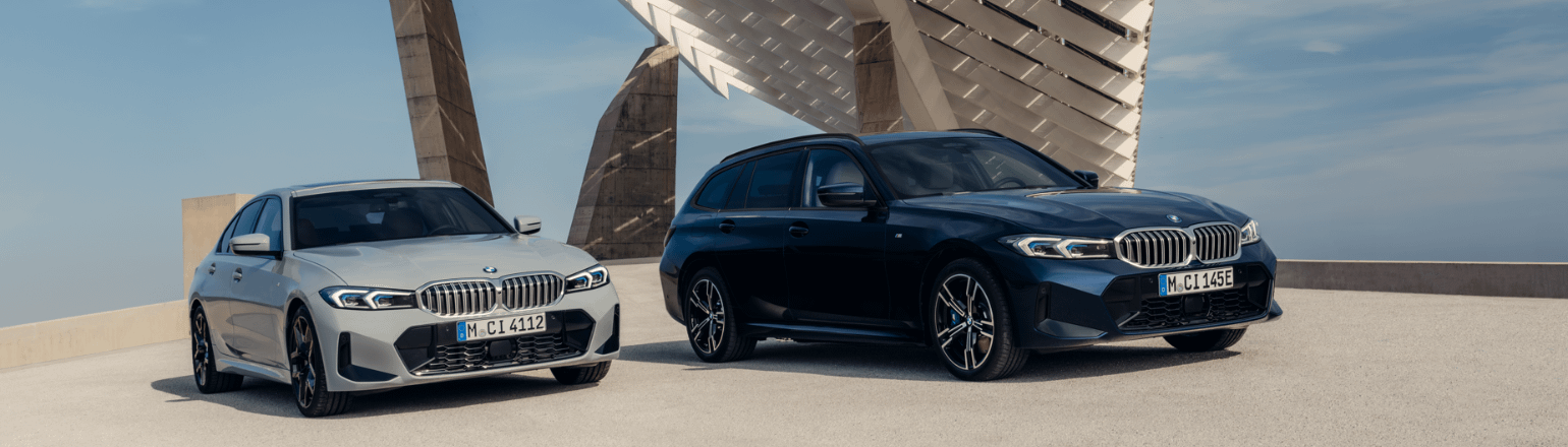 BMW saloon and touring models parked side by side.