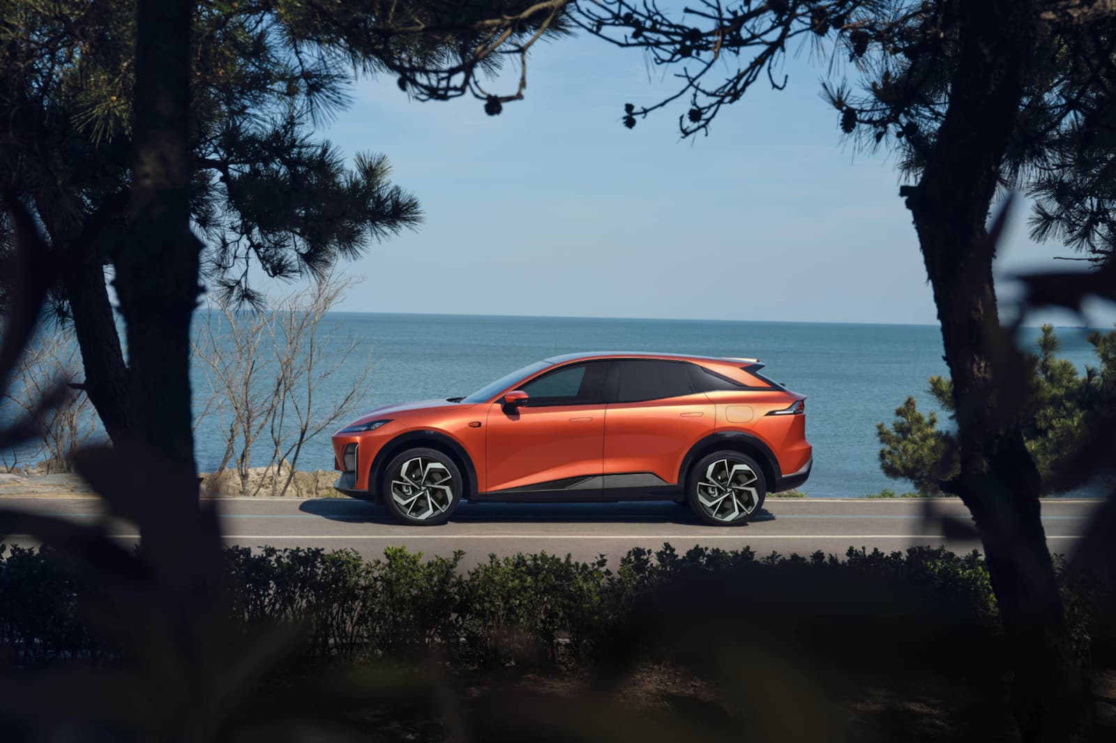 orange changan driving by the sea