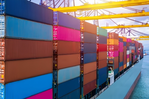 Shipping containers loaded onto a cargo vessel for international transport.