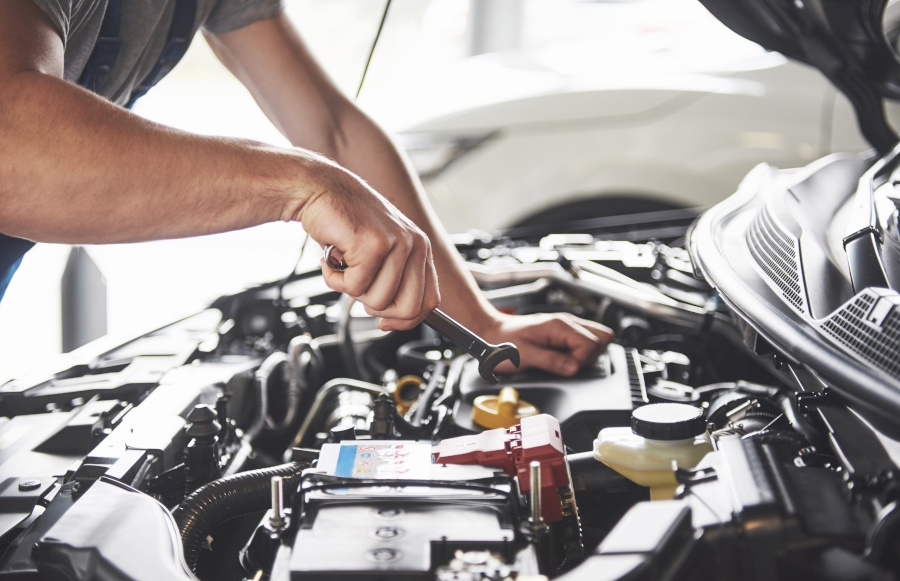Mechanic Working On Engine