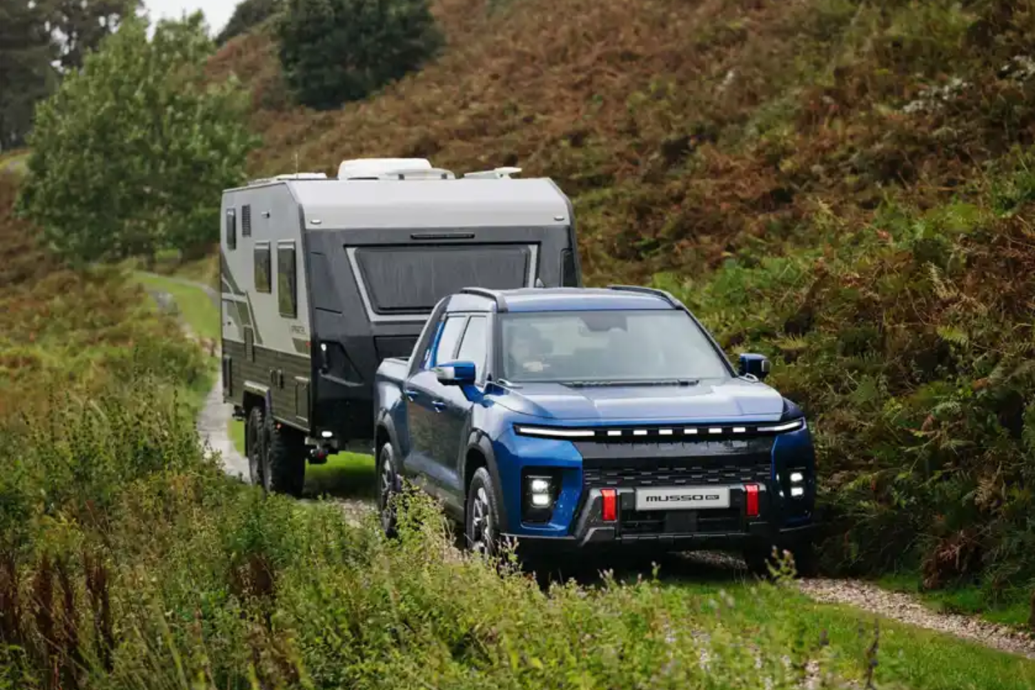 Musso EV towing a caravan