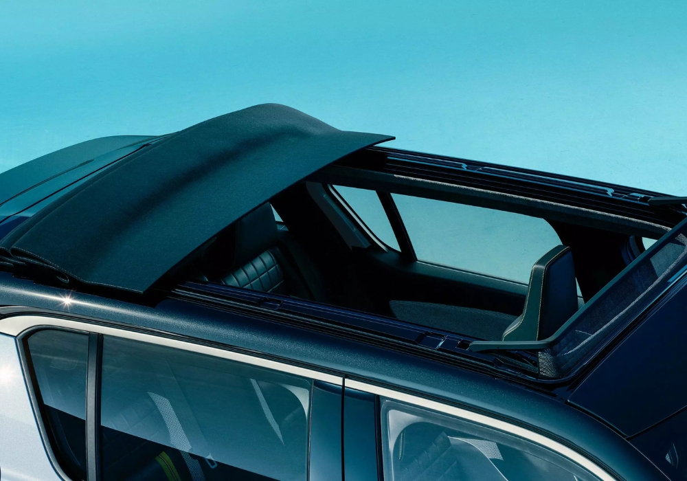Renault 4 E-Tech retractable fabric roof open, showing interior from above.