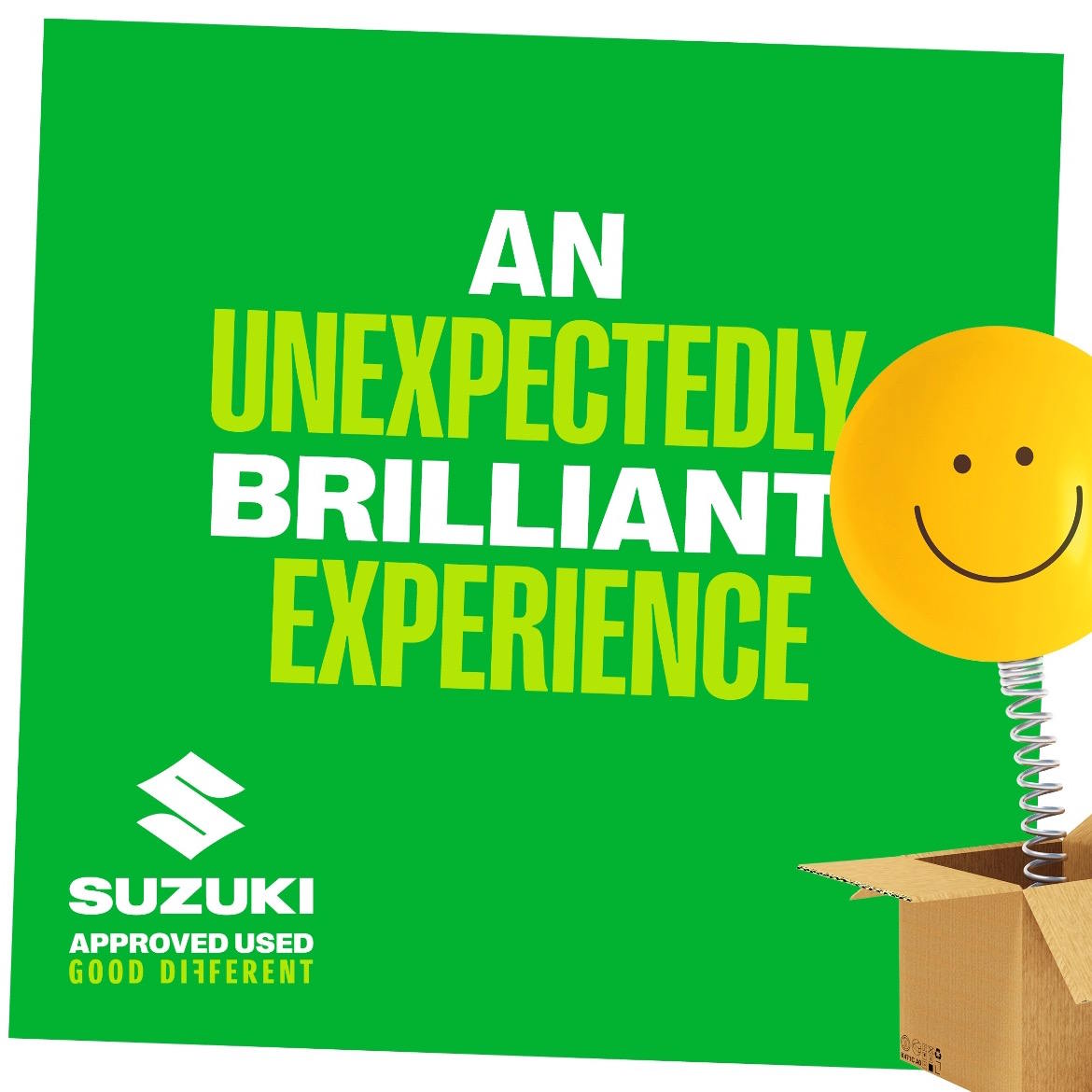 Suzuki Approved Used promotional graphic featuring a cheerful yellow smiley face on a spring emerging from a box, with 'An Unexpectedly Brilliant Experience' messaging on a vibrant green background.