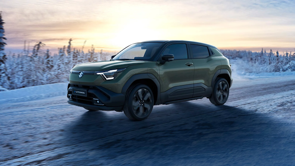 green Suzuki e Vitara on an ice road