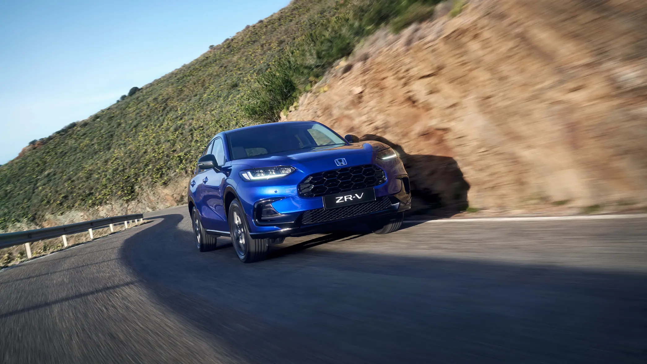 Blue Honda ZR-V Driving