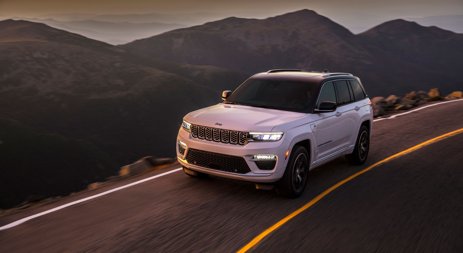 white jeep by the mountains