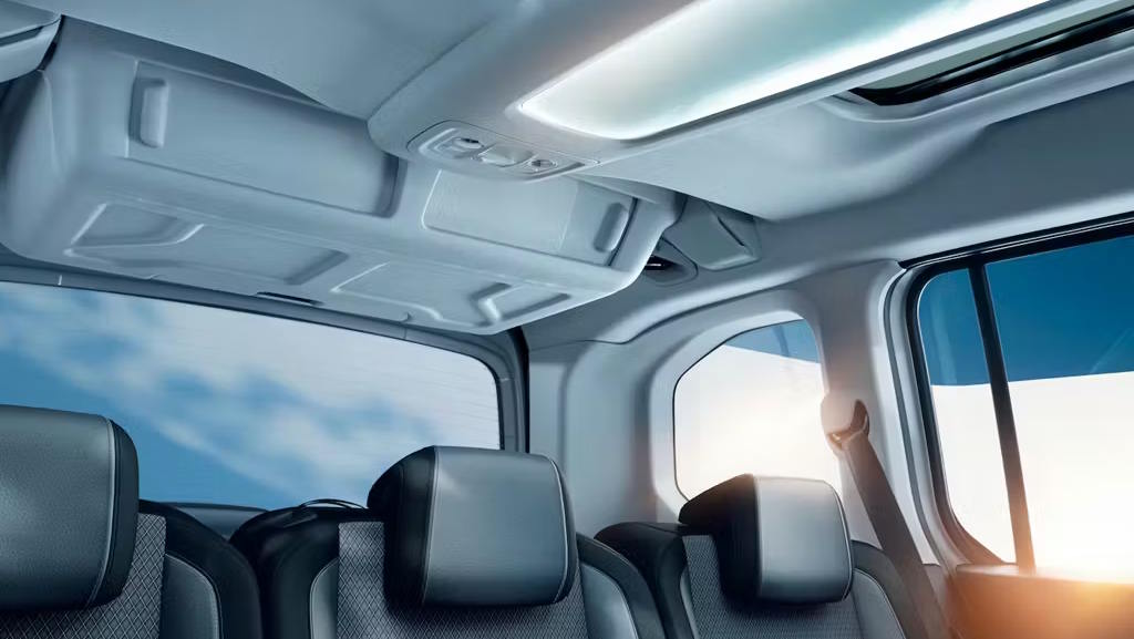 Rear passenger area of the Vauxhall Combo featuring a panoramic glass roof and spacious seating.