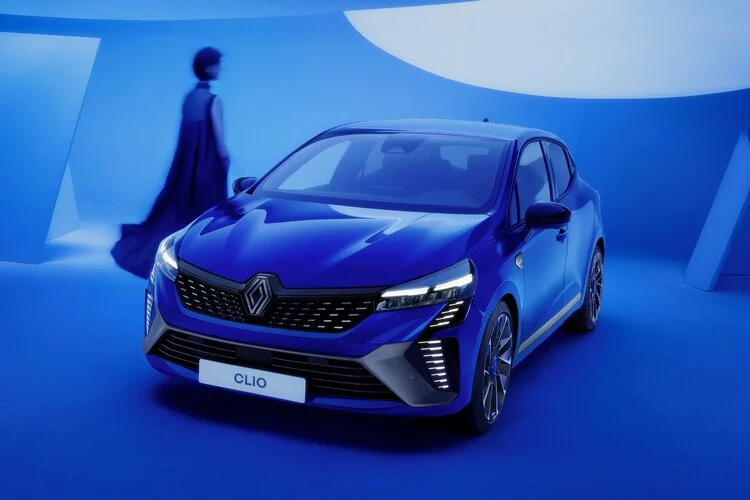 Blue Renault Clio on blue background front facing