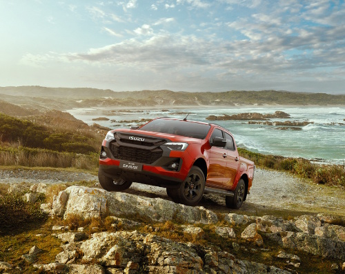 red ISUZU D-MAX Isuzu UTILITY on the rock