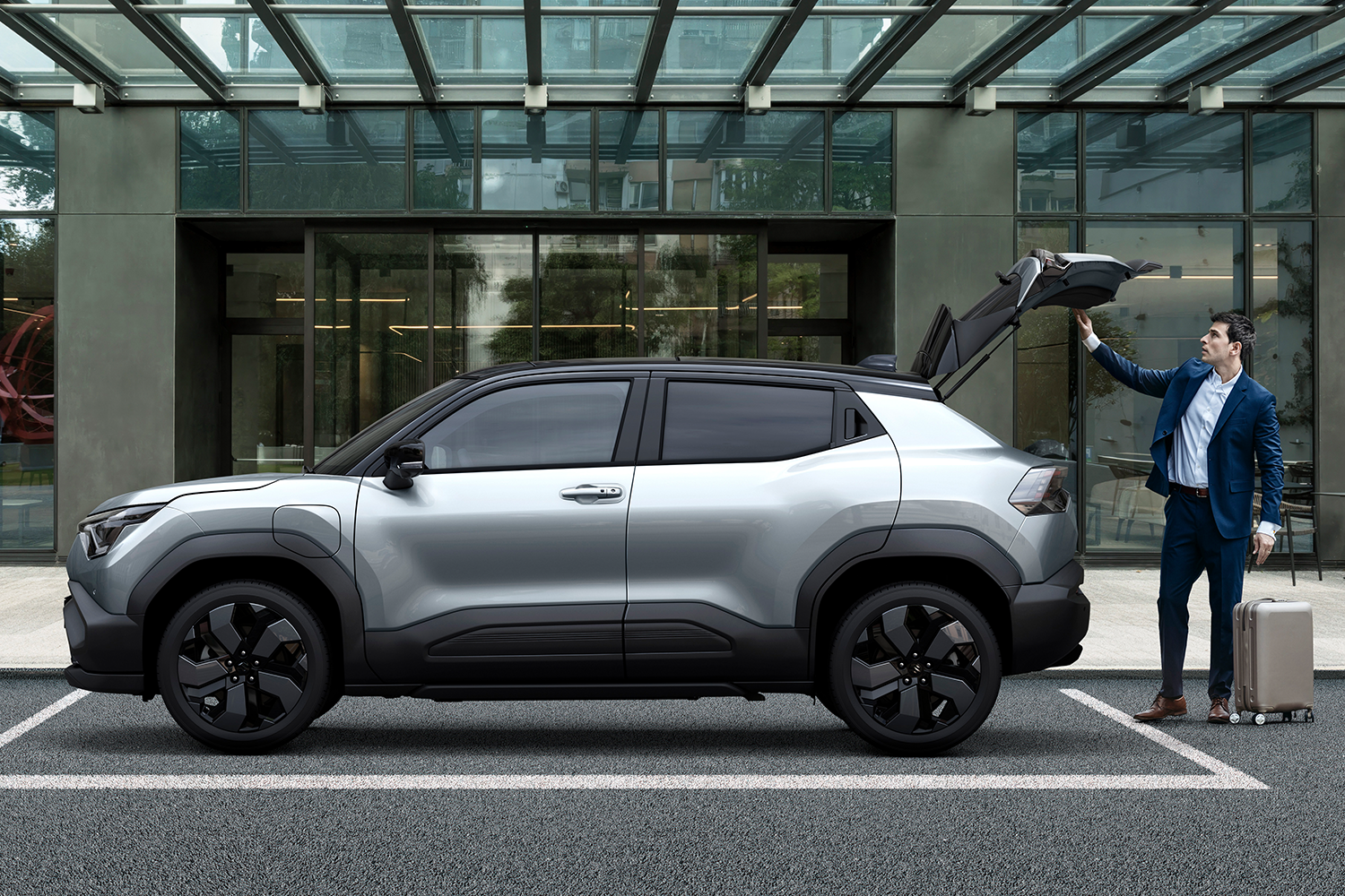 man opening the boot of the new suzuki e-VITARA