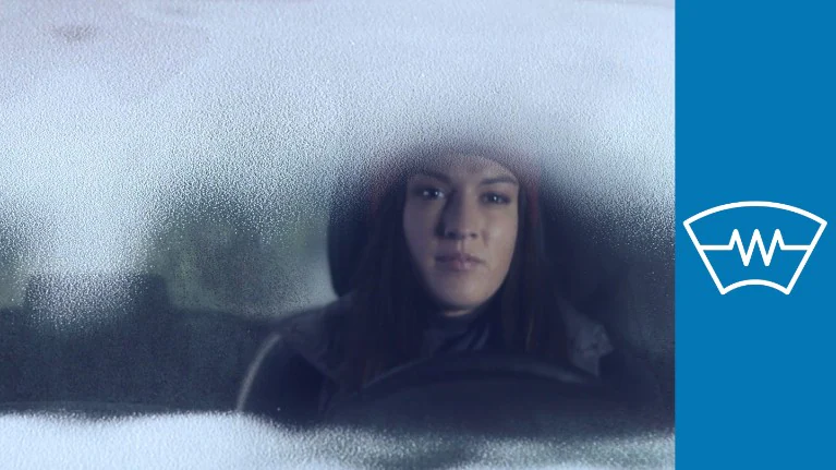 Heated windscreen clearing snow and frost in cold weather.